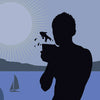 A silhouetted figure holds a cup with a jumping fish against a blue backdrop of sunburst, mountains, and sailboat. "Page of Cups" appears on this inclusive card from the Spirit Within Tarot by Schiffer Publishing, Ltd.