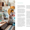 A cozy, sunlit craft room with shelves of colorful yarn, plants, and weaving supplies. A large wooden loom is by the window. Text on the right page introduces Schiffer Publishing’s Welcome to Weaving 2 for intermediate weavers.