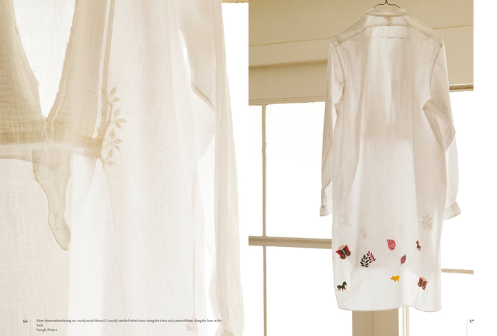 Embroidery Garden" by Schiffer Publishing, Ltd. is displayed before sunlit windows; a close-up highlights the delicate floral embroidery on the sleeve, showcasing the intricate texture and detail of this white shirt.