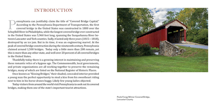 Pennsylvania's Covered Bridges by Schiffer Publishing, Ltd. depicts a red covered bridge with a white roof crossing a stream, green grass and trees around it, plus a stone wall and steps leading to the entrance under a clear sky.