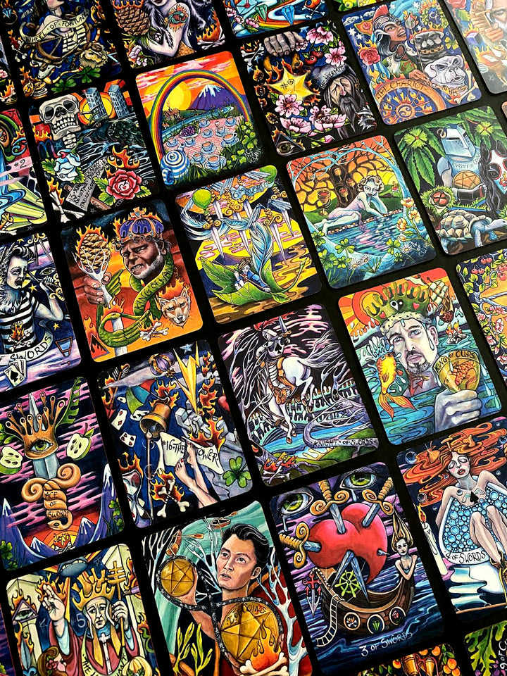 The Bonefire Tarot by Schiffer Publishing, Ltd. showcases hand-painted cards with vibrant illustrations of figures, symbols, and mystical elements, all arranged in a slightly overlapping display.