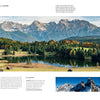 The Wild Alps" by Schiffer Publishing, Ltd. captures serene mountain lakes reflecting forested hills and rugged Alpine peaks, with wooden huts dotting green meadows—an ideal inspiration for Alps photography.