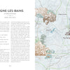 A memoir page from "Atlas of Lost Paradises" by Schiffer Publishing, Ltd. features text on the left and a topographic map on the right, depicting mountains, rivers, and towns like Digne-les-Bains, Mezel, Saint-André, and Brignoles.