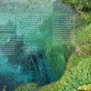 A crystal-blue spring framed by greenery is featured on "On the Road—Traveling Europe in a Campervan" from Schiffer Publishing, Ltd., with descriptive text and directions—your perfect inspiration for a campervan journey across Europe.
