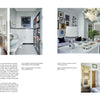 Get home design inspiration from "Interior Designers at Home" by Schiffer Publishing, Ltd., featuring modern apartments with white kitchens, globe pendant lights, graphic artwork, and designer-style touches like shelves and framed art.