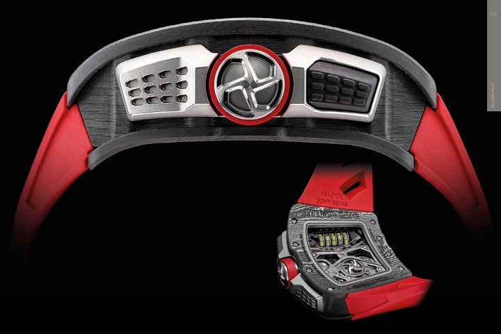 A close-up side view of "The Art of Luxury Design" from Schiffer Publishing, Ltd. is shown against a black background, featuring sleek, automotive-inspired aesthetics with metallic details and bold red accents.