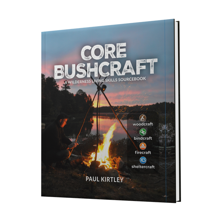 3D-rendered cover of Core Bushcraft by Schiffer Publishing, Ltd., showing a campfire by a lake at sunset with a person nearby—perfect for anyone interested in learning key bushcraft and wilderness living skills.