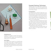 A modern crafter's flat lay: yarn, needles, scissors, fabric, seam ripper—all beside Threads of Treasure by Schiffer Publishing, Ltd., open to stitching techniques and running stitch embroidery. Small polar bear sketches accent the bottom left.