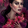 A stylized woman with dark hair and bold makeup, inspired by The Flowerwise Oracle from Schiffer Publishing, Ltd., is surrounded by pink hibiscus flowers. Text below reads: Hibiscus. Trust, be ready. Hold tight to your dreams. A blue water drop icon appears.