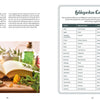An open book, "Saint Hildegard’s Guide to Wellness" by Schiffer Publishing, Ltd., sits on a wooden table with glass bottles, herbs, and a “Hildegardian Cosmetics” chart listing herbal remedies for holistic skin and hair care.