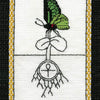 A cross-stitched tarot card from The Butterfly Wisdom Tarot by Schiffer Publishing, Ltd. features a green butterfly on leaves above roots circling an ankh, gold-bordered, and labeled ACE OF DISKS at the bottom.