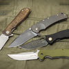 Four Schiffer Publishing, Ltd. Folding Knives, featuring diverse handle materials and blade styles, are displayed open and overlapping on olive green fabric—ideal for a modern pocketknife guide highlighting unique finishes.