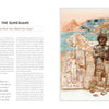 A page from "Atlas of Lost Civilizations" by Schiffer Publishing, Ltd. displays ancient Sumerian culture with artifacts like statues, carvings, a blue-bricked ziggurat with two bulls, and world atlas text about their civilization.