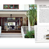 A person and dog welcome you at the entrance of a home with a spacious porch, showcased alongside a sketched house. Discover more in "Contemporary Southern Vernacular" from Schiffer Publishing, Ltd.
