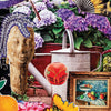 A collage showcases hydrangeas, a metal watering can, colorful fans, a stone bust, sunflowers, and a framed still-life painting—reflecting the elegance of Couture Tarot by Schiffer Publishing, Ltd., with "Nine of Pentacles" at the bottom.