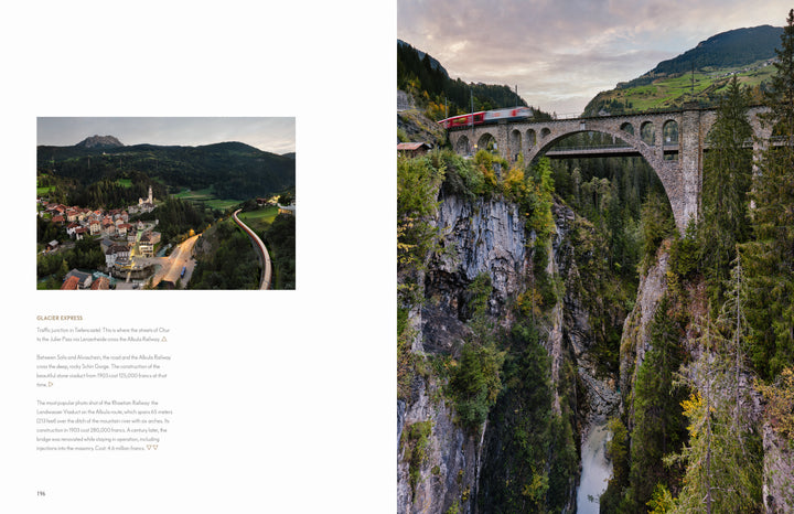 Experience Alpine Railways by Schiffer Publishing, Ltd.: a red train crosses a towering stone viaduct over a wooded gorge, mountains and forests all around, offering one of the most scenic routes in the European Alps beneath cloudy skies.