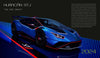 A blue Automobili Lamborghini Special Edition by Schiffer Publishing, Ltd. sits on a lit platform with red accents and STJ lettering, described as “The Last Dance” celebrating Lamborghini’s luxury sportscar legacy and 2024 release.