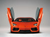 A front view of the Automobili Lamborghini Special Edition by Schiffer Publishing, Ltd. showcases its scissor doors open in a studio with a gray background—ideal for luxury sportscar and Automobili Lamborghini aficionados.