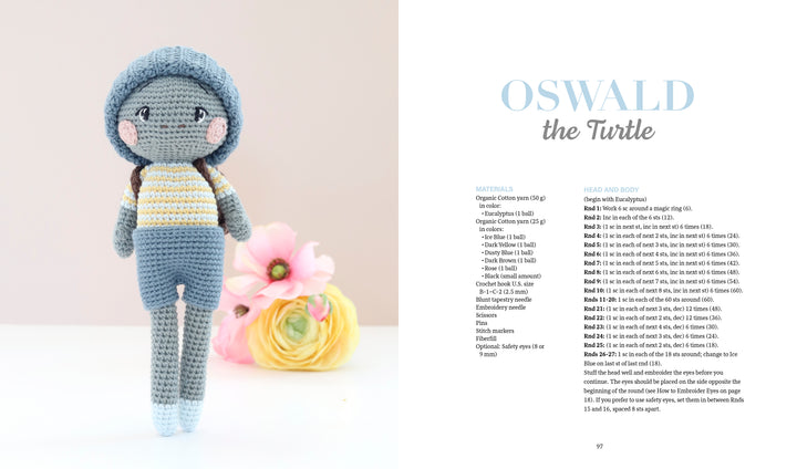 A blue-shelled crocheted turtle with a gray body, yellow-striped shirt, and blue pants stands beside pastel flowers. The crochet book "Sweet and Simple Amigurumi Friends" by Schiffer Publishing, Ltd. shows amigurumi instructions.