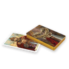 The Camelot Oracle by Schiffer Publishing, Ltd. features an Arthurian-inspired tarot deck, partly open to reveal a regal king with a sword and a top card adorned with an ornate golden dragon—ideal for divination and themed readings.
