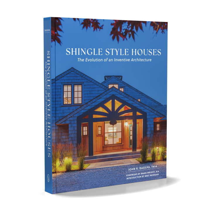 Shingle Style Houses by Schiffer Publishing, Ltd. showcases contemporary shingle homes, with a cover depicting a warmly lit blue house at dusk that reflects the inventive spirit of this architectural style.