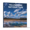 Yellowstone National Park by Schiffer Publishing, Ltd. features a vibrant hot spring, cloudy sky, and trees on the cover, celebrating the geothermal wonders of Yellowstone National Park.