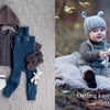 A flat lay of "Baby Knits from Norway" patterns by Schiffer Publishing, Ltd. on the left; on the right, a baby in Nordic-inspired knitwear with a bear-ear hat sits outdoors. Text reads: Darling Layette Set.