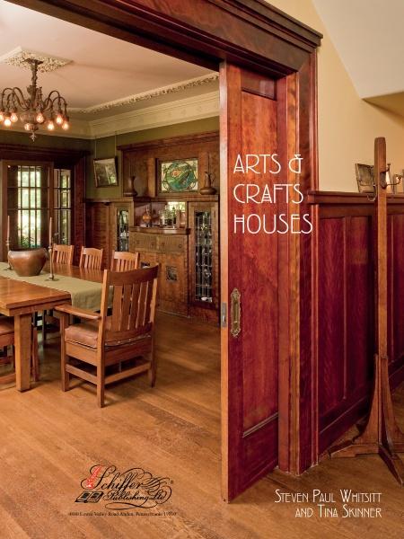 A cozy, wood-paneled dining room with craftsman-style furniture and stained glass accents graces the cover of Arts & Crafts Houses by Schiffer Publishing, Ltd.