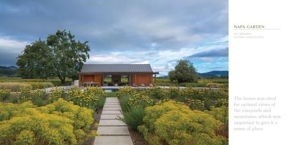 Inspired by "Regional Landscape Architecture: Northern California" from Schiffer Publishing, Ltd., a wooden house with a metal roof sits at the end of a stone path, surrounded by lush flowers and gardens with mountains in the background.