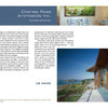 A modern house with glass walls and a wooden deck reflects the innovative home design featured in "Contemporary Boston Architects" by Schiffer Publishing, Ltd.