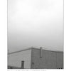 A flat-roofed maintenance building beneath a gray sky evokes the mysteries of UFOs Above PA by Schiffer Publishing, Ltd. Caption: Penncrest High School, Media, Pennsylvania.