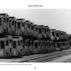 Black and white photo of old subway cars stacked in a scrapyard, evoking vintage graffiti art. Inspired by New York Subway Graffiti from Schiffer Publishing, Ltd. Railway tracks run in the foreground, recalling an iconic urban era.