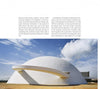 A modern white dome building stands against a blue sky with a flat tan walkway. Beside it, text notes its architectural significance and the "Igloo" book by Schiffer Publishing, Ltd., which explores contemporary igloo-inspired design.