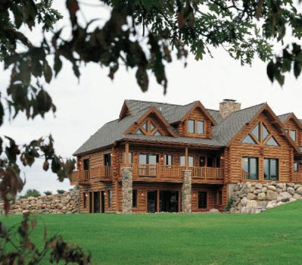 The Best of Today's Log Homes by Schiffer Publishing, Ltd. features classic log cabins with gabled roofs, stone chimneys, and wraparound balconies, perfect for inspiring your own log home floor plans.
