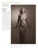A woman models a long, sheer, feathered gown in a softly lit studio. Beside her, text highlights Olivia Grace Deeney and her womenswear designs, excerpted from Schiffer Publishing, Ltd.'s Europe: Rising Fashion Designers.
