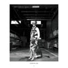 A man and his dog share a quiet moment in the firehouse, featured in "Local Heroes" by Schiffer Publishing, Ltd.—an authentic glimpse into firehouse life.