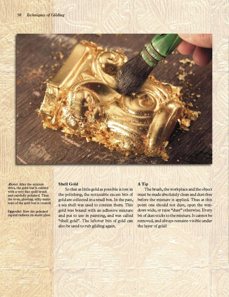 A hand uses a brush to apply gold leaf onto an ornate raised surface, with loose gold flakes nearby. The textured background shows text about the history of gold and gilding techniques from "GOLD" by Schiffer Publishing, Ltd.