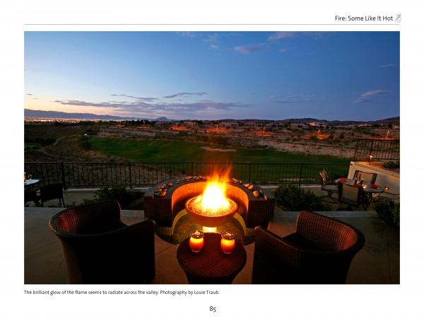 Four wicker chairs circle a glowing fire pit at dusk, set on a patio with golf course views. Inspired by "New Ideas for Living Outdoors" from Schiffer Publishing, Ltd., this backyard scene shows how candles elevate outdoor living spaces.
