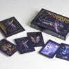 The Inner Realms Tarot by Schiffer Publishing, Ltd. is shown with its box, companion book, and six illustrated cards on a white surface. Its mystical, dark artwork inspires intuitive tarot readings.