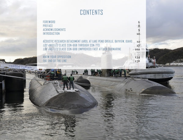 Two US Navy fast attack submarines are docked at a harbor with crew members on top. A translucent table of contents for "The US Navy's Fast Attack Submarines, Vol. 1" by Schiffer Publishing, Ltd. overlays the image.