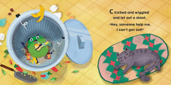In Schiffer Publishing, Ltd.’s "C Jumped over Three Pots and a Pan and Landed Smack in the Garbage Can!", a green frog stuck in a food-filled trash can calls for help while a gray cat naps nearby—an imaginative ABC adventure with text on the image.