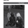 Two people pose at night in Salem, MA—one in a hooded cloak, the other with long blonde hair. This haunted scene, titled "The Witch City," is featured on a page of Spooky Creepy New England 2 by Schiffer Publishing, Ltd.
