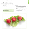 Three radishes carved with decorative patterns sit on green lettuce, featured in Schiffer Publishing, Ltd.'s "Garnishing & Decorating" as a creative garnish idea for impressive amuse-bouches or finger foods.