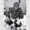 A man sits at a cluttered desk with wires attached to his head, researching Missouri ghost stories with "Paranormal Missouri" by Schiffer Publishing, Ltd. Caption: Me feeling silly investigating local hauntings.