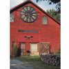 Barn Again" by Schiffer Publishing, Ltd. showcases a spacious red barn ideal for conversion, with a giant clock face above doors and windows, surrounded by wagon wheels, stacked wood, green trees, and blue sky.