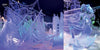 At the ice festival, blue and purple lights highlight Schiffer Publishing, Ltd.'s "Contemporary Ice Sculpture": a shipwreck with sails and rigging on the left, and a woman with flowing hair on part of a ship on the right.