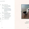 An open Conversations with Nell book (Schiffer Publishing, Ltd.) shows a chat on the left and a photo of two dogs—one is black Labrador Nell—running in shallow Devon water on the right, under Chapter 6: Together Again, set in Devon, England.
