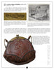 A vintage magazine page displays Artistic Leather of the Arts and Crafts Era by Schiffer Publishing, Ltd., with text, a sepia photo of a leatherworking studio, and a close-up of a hand-tooled, ornately embossed brown leather handbag.