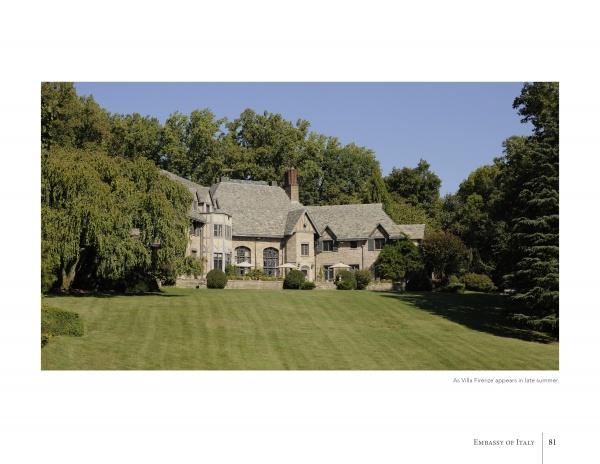 A large stone villa with multiple chimneys and peaked roofs sits amid green trees, resembling those featured in "Diplomatic Gardens of Washington" by Schiffer Publishing, Ltd., facing a manicured lawn under a clear blue sky.