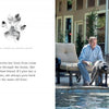 A man lounges poolside, spraying water from a hose at his black Labrador beside him. Enjoy outdoor moments like these in "At Home with Dogs" from Schiffer Publishing, Ltd.—the perfect inspiration for dog lovers.